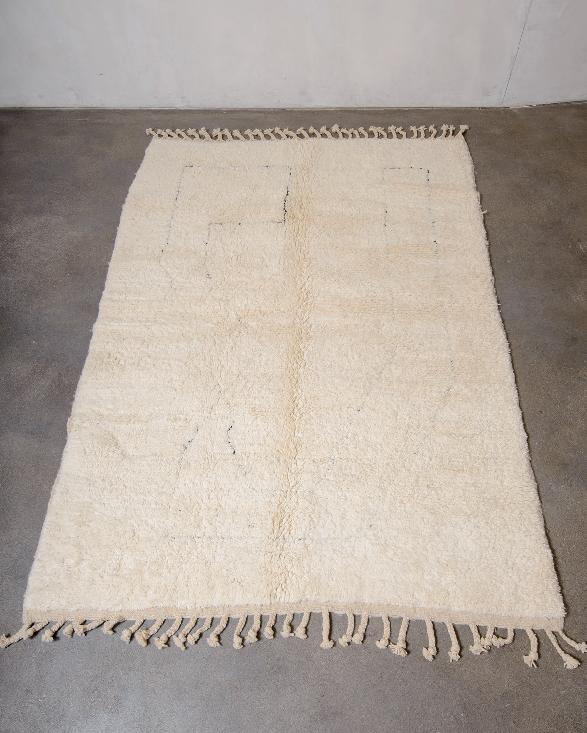 Modern, designer, handcrafted Berber rug from Morocco. Beniourain carpet with minimalist design, natural wool pile and a fluffy texture.